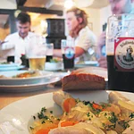 Bratwürste (sausages) which are boiled in a spicy vinegar and onion stock.