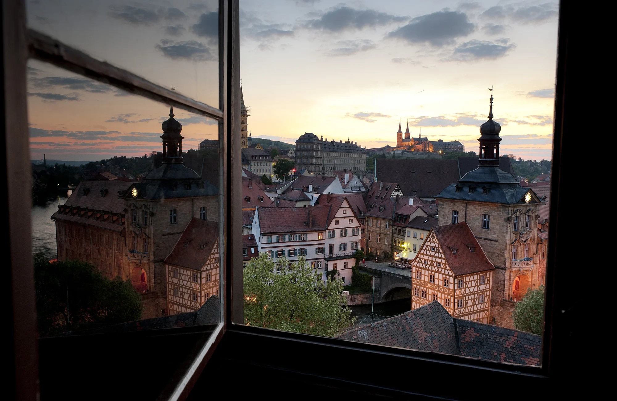 The view from the tower of the renaissance castle Geyerswörth to the episcopal town - part of the World Cultural Heritage Site - is one of the most beautiful views in town. Especially in the evening Bamberg gleams in a very special atmosphere.