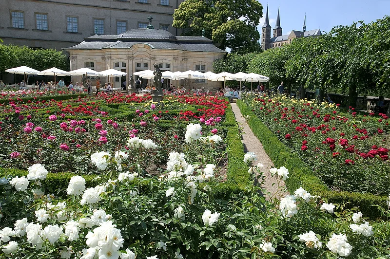 The rose garden of the New Residence fascinates particularly in summer and offers a splendid view over the city and to St. Michael. The rose garden of the New Residence fascinates particularly in summer and offers a splendid view over the city and to St. Michael.