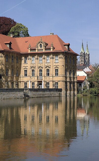 The baroque moated castle hosts the International House of Artists Villa Concordia.